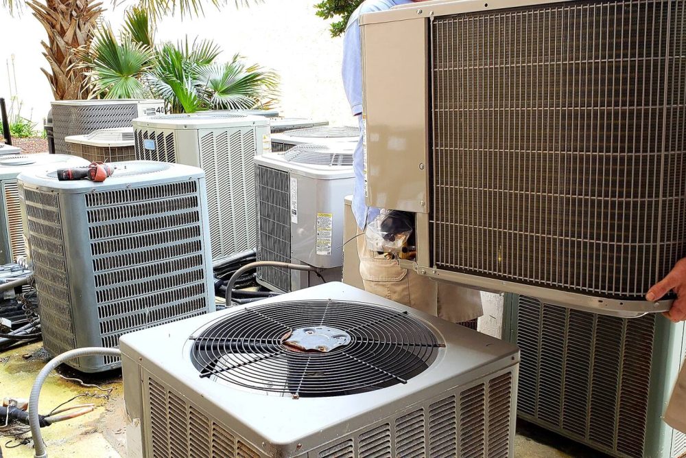 hvac-technician-removing-old-rusted-broken-aircond-2022-11-12-09-50-49-utc